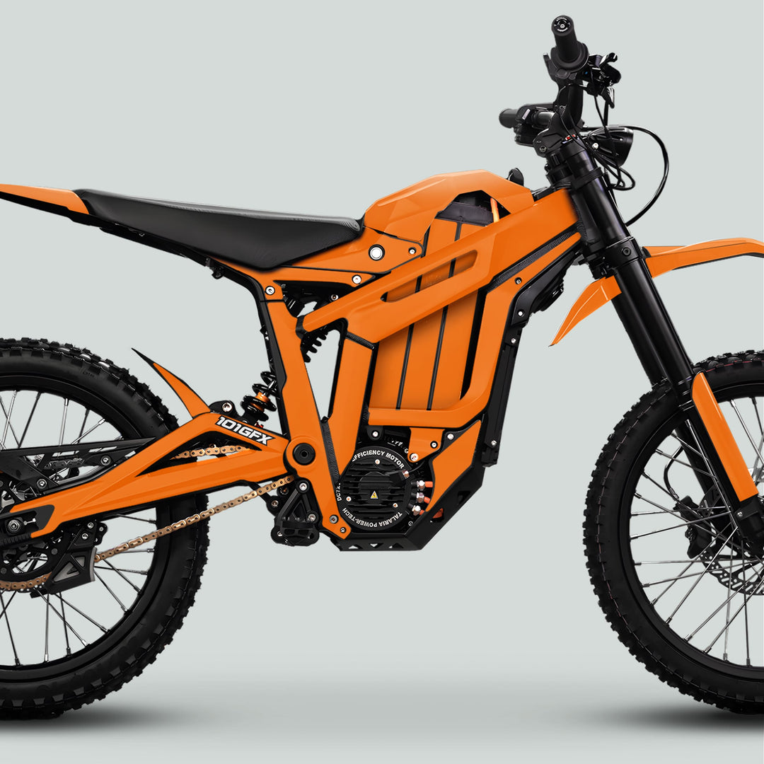 Talaria Sting MX5 PRO Graphics Kit SOLID COLOR Orange Decals on rugged electric motorcycle, showcasing battery, motor, suspension, knobby tires, and motocross seat for a stylish transformation.