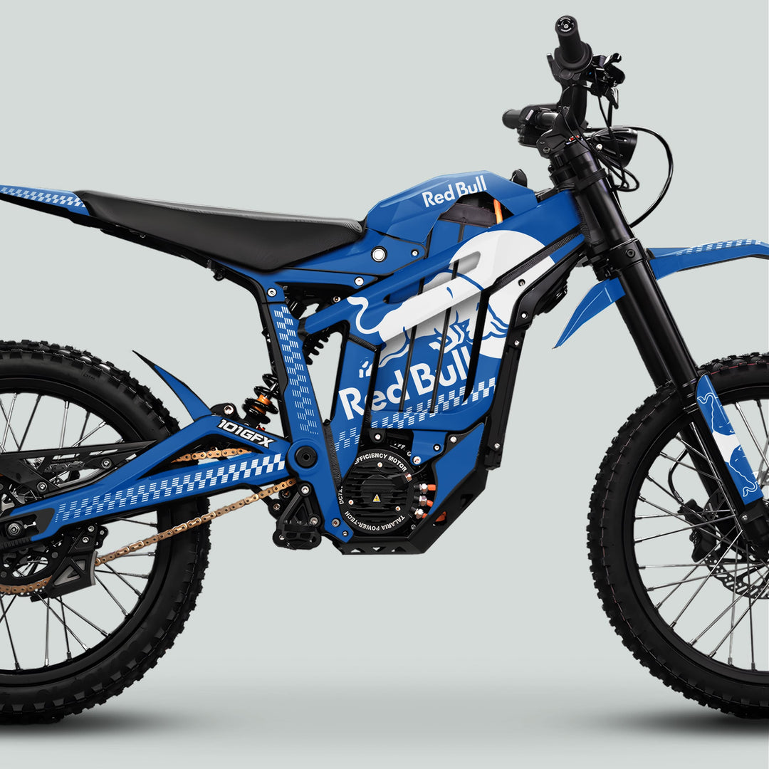 Side-profile of a blue off-road electric dirt bike with Red Bull graphics, showcasing the Talaria Sting MX5 PRO Graphics Kit RBULL MONO Blue White Decals.