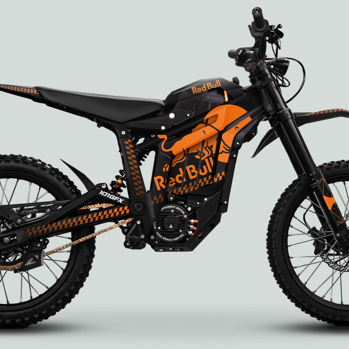 Talaria Sting MX5 PRO Graphics Kit RBULL MONO Black Orange Decals on a Red Bull electric dirt bike, showcasing sleek design and durable materials for standout style.