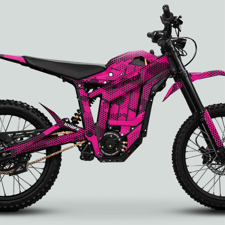 Talaria Sting MX5 PRO Graphics Kit HEXOCAM MAGENTA Decals on an electric off-road bike, featuring integrated battery housing, suspension, knobby tires, and minimalist panels.