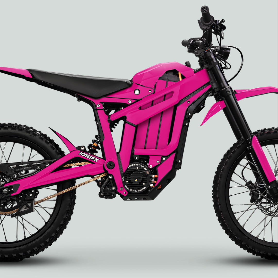 Talaria Sting MX5 PRO Graphics Kit SOLID COLOR Magenta Decals on a pink off-road electric dirt bike with knobby tires, full suspension, and disc brakes.