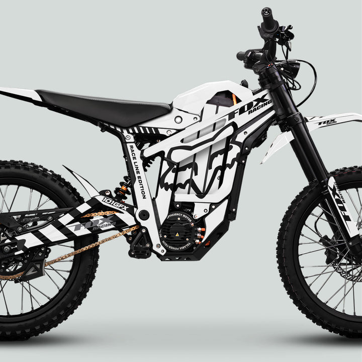 Side-profile of a Fox Racing electric motorcycle featuring the Talaria Sting MX5 PRO Graphics Kit in the FOX RACELINE style with motocross components.