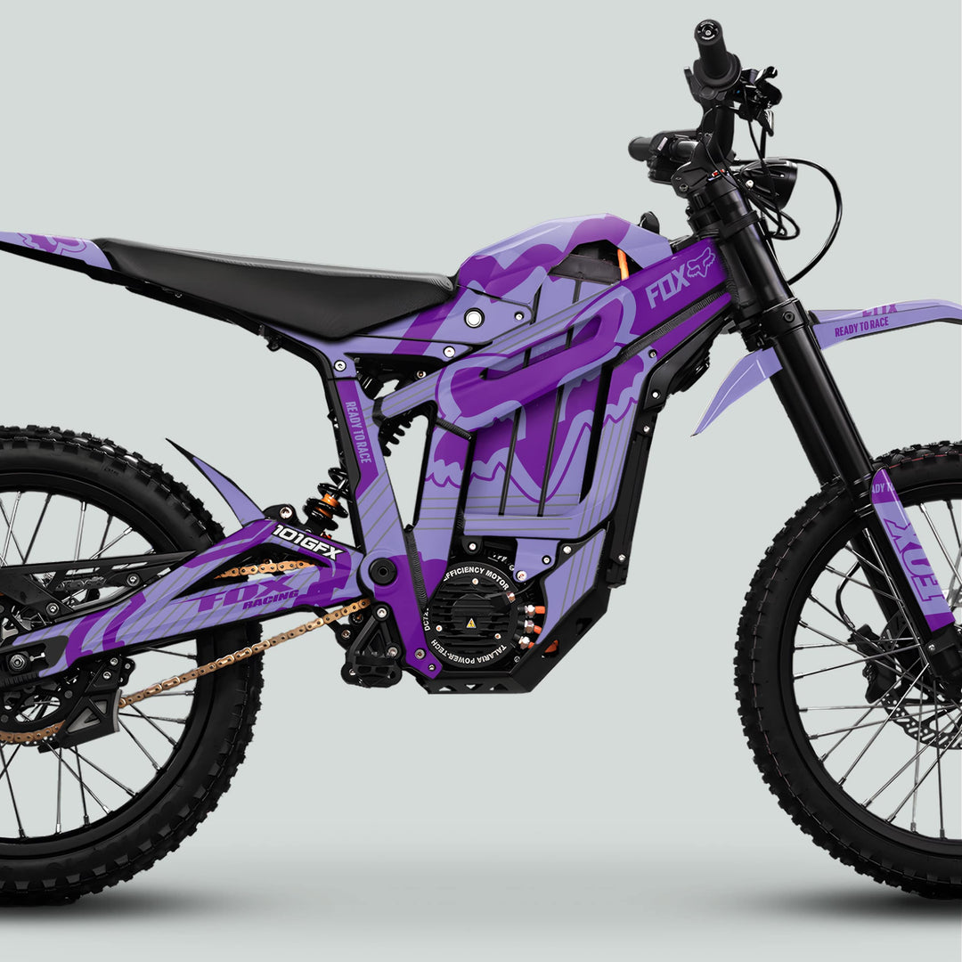 Talaria Sting MX5 PRO Graphics Kit FOX STRIPES Duo Purple Decals on an off-road electric dirt bike with knobby tires and racing graphics.