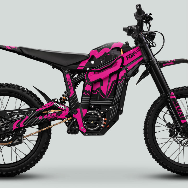 Talaria Sting MX5 PRO Graphics Kit FOX STRIPES Black Magenta Decals on an electric dirt bike featuring off-road suspension, knobby tires, and sleek Fox Racing livery.