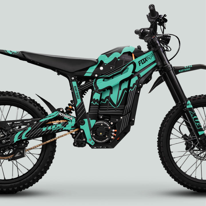 Talaria Sting MX5 PRO Graphics Kit FOX STRIPES Black Mint Decals on an electric off-road motorcycle, showcasing Fox Racing–style graphics, knobby tires, and long-travel suspension.