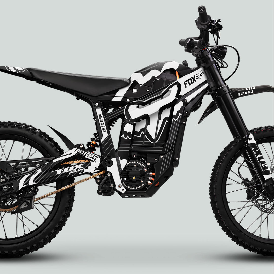 Side-profile of Talaria Sting MX5 PRO Graphics Kit FOX STRIPES, showcasing knobby tires, heavy-duty suspension, and sleek READY TO RACE branding on motocross E-bike.