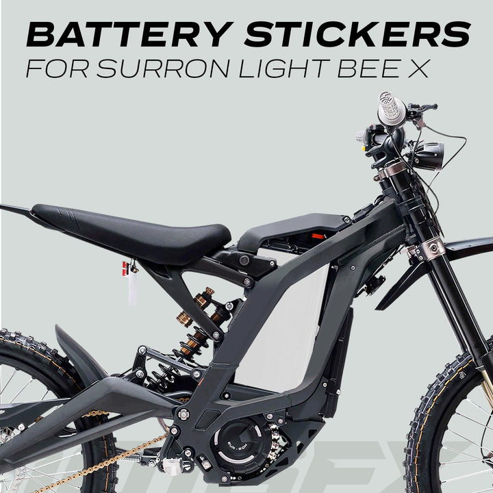 Surron Light Bee X Battery Stickers SOLID White on side view of bike, showcasing sleek decal on battery compartment, highlighting enhanced style and protection.