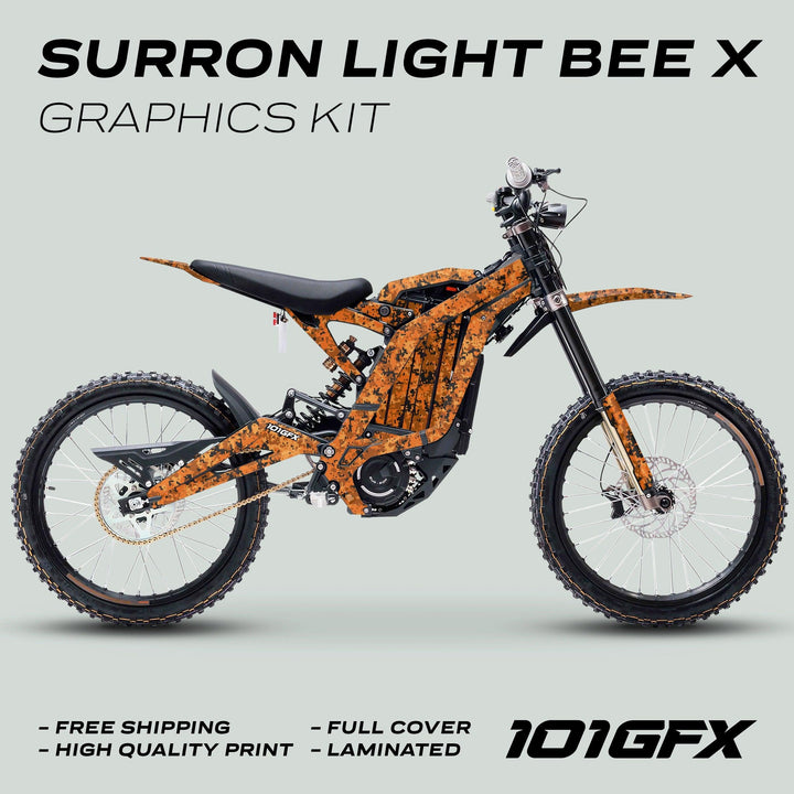 Surron Light Bee X Graphics Kit SQUARE TEK Orange on electric dirt-bike, features orange digital-camo decals covering frame, fork legs, swingarm, fenders, with overlaid promotional text.