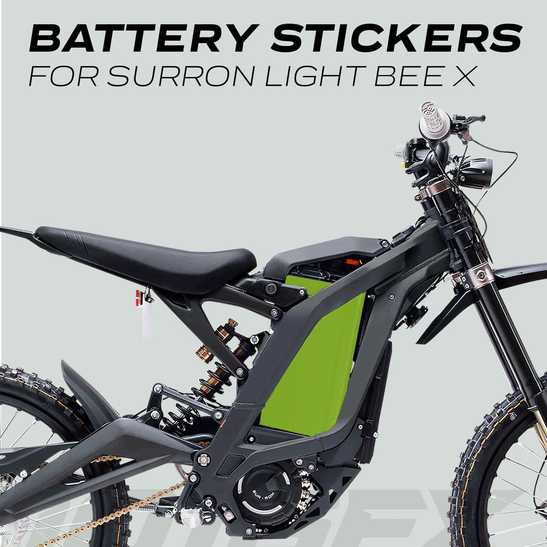 Surron Light Bee X Battery Stickers SOLID Green on bike, highlighting vibrant green decal on battery housing, enhancing bike's aesthetic with custom style.