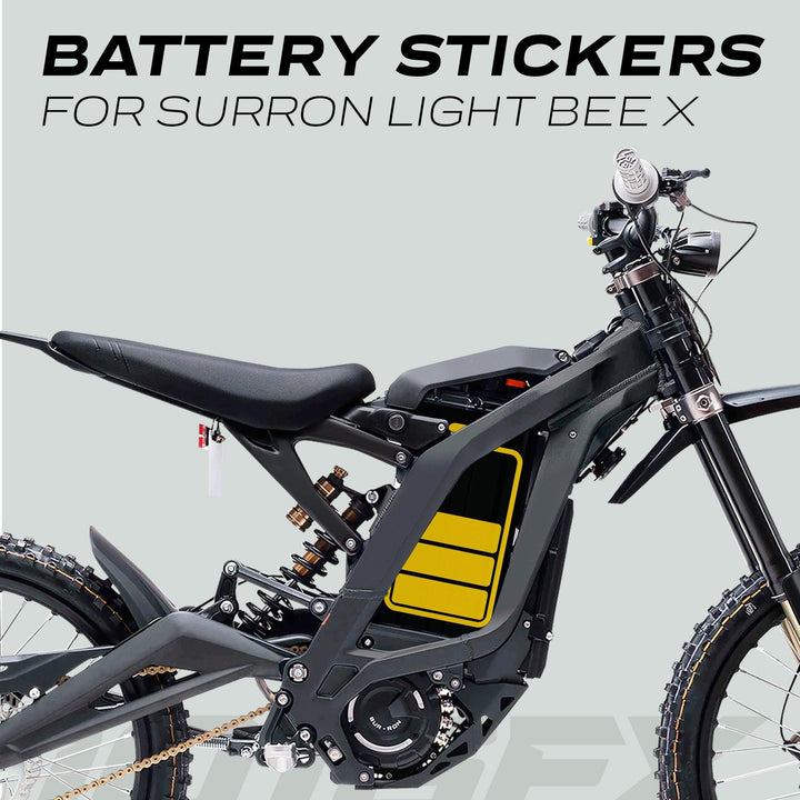 Surron Light Bee X Battery Stickers ICON HALF displayed on bike frame, showcasing yellow decals designed for aesthetic enhancement and battery protection.