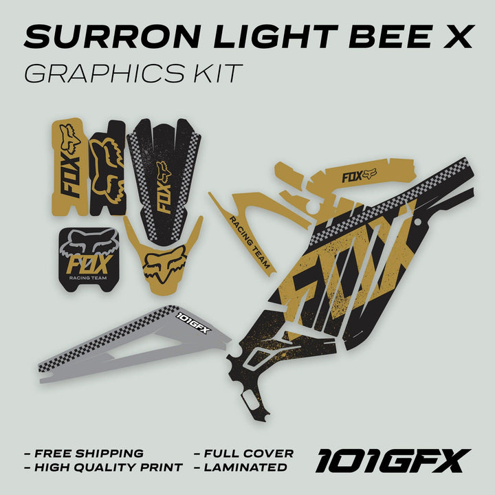 Surron Light Bee X Graphics Kit FOX DUST Black Gold: Black-and-gold Fox Racing-themed decals for Surron bikes. Includes fender guards, side-panel covers, shock-guard strips.