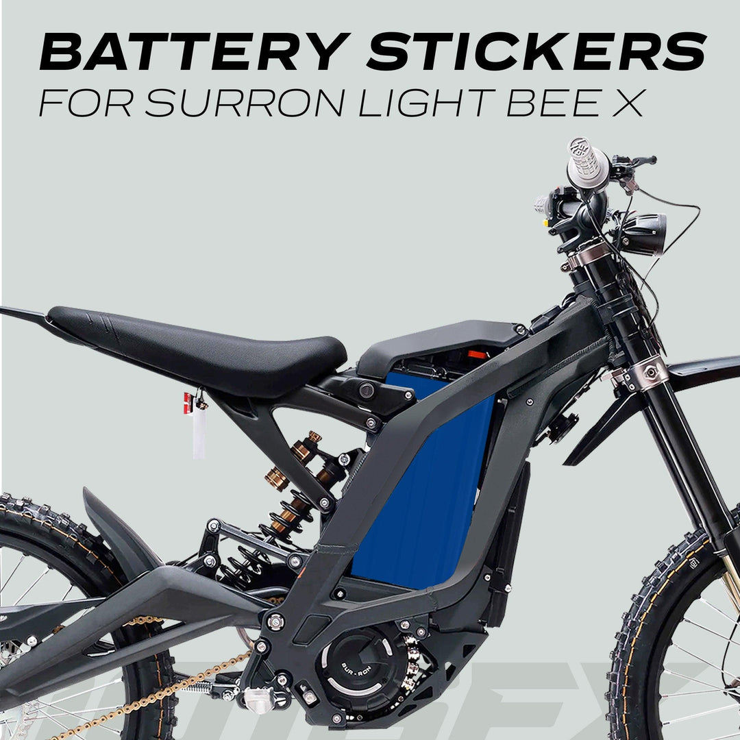 Surron Light Bee X Battery Stickers SOLID Blue applied to the bike's battery module, highlighting stylish protection and customization for the Surron electric dirt-bike.