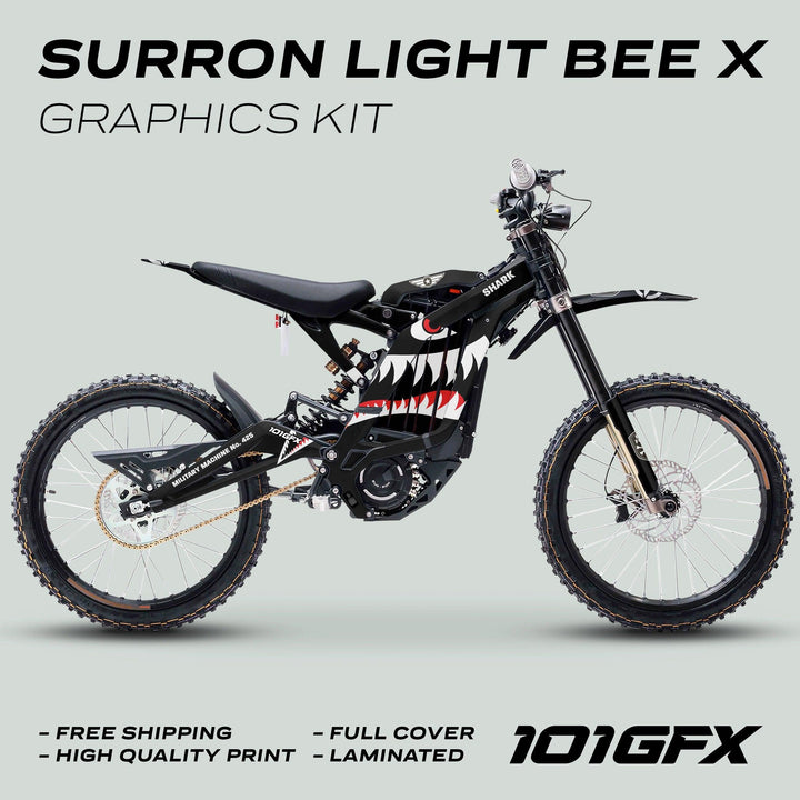 Surron Light Bee X Graphics Kit MILITARY SHARK Black on bike, showcasing shark-mouth decal. Highlights: free shipping, full cover, quality print, laminated finish.