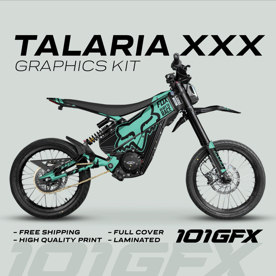Talaria XXX Graphics Kit FOX STRIPES Black Mint on electric dirt-bike, featuring turquoise-and-black decals, fox-head logo, and “FOX READY TO RACE” text, highlighting style and protection.