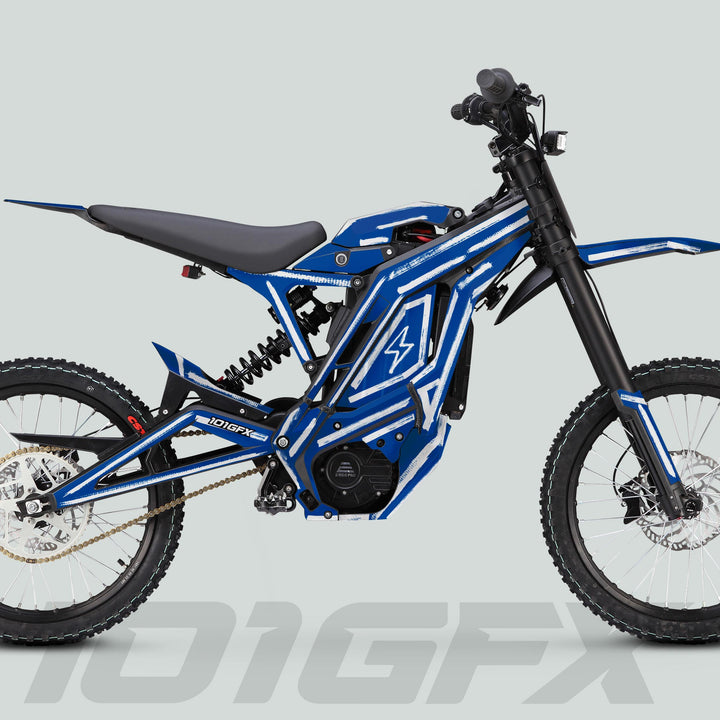 Side-profile of a blue electric off-road motorcycle featuring the E Ride Pro SS Graphics Kit BRUSH Blue White, showcasing its tubular frame, knobby tires, and sleek design.