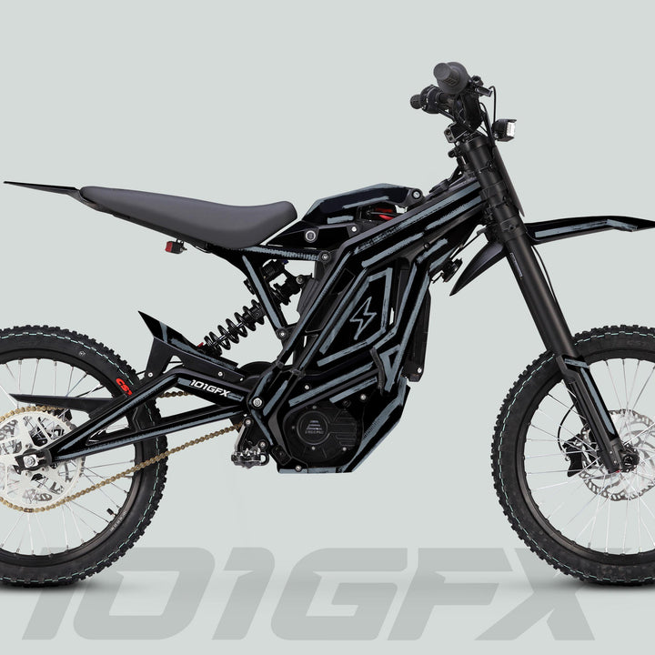 Side-profile of a black electric dirt bike featuring the E Ride Pro SS Graphics Kit BRUSH Black Grey, enhancing style with durable, weather-resistant decals on the chassis.