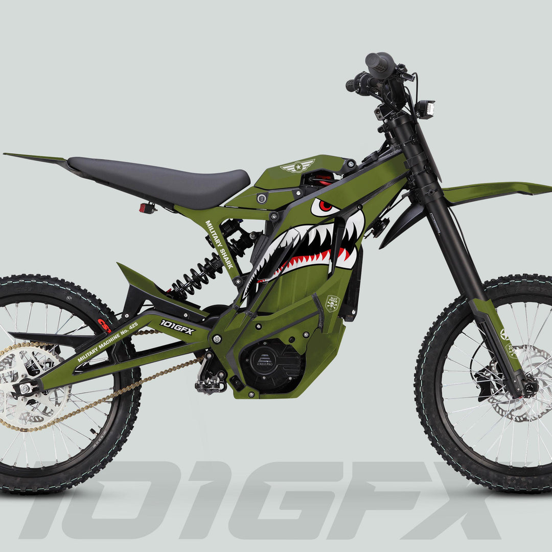 E Ride Pro SS Graphics Kit MILITARY SHARK OLIVE Black on an olive green e-motocross bike, featuring knobby tires, shark-mouth graphic, and model branding 101GFX.