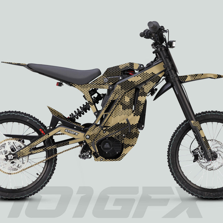 E Ride Pro SS Graphics Kit HEXOCAM SAND on an electric dirt bike with tan-black camouflage frame, off-road tires, and mid-mounted motor.