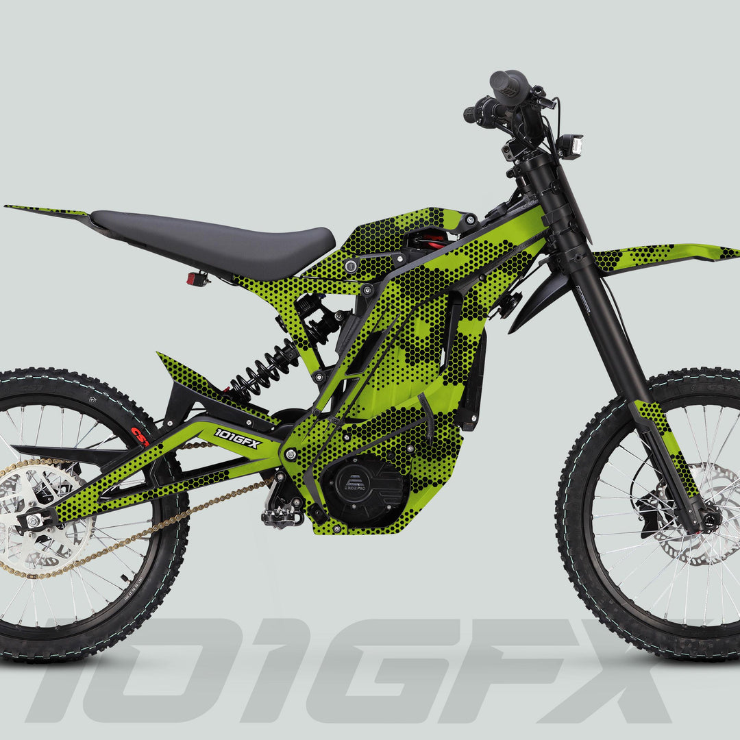 Side-profile of a green-and-black off-road electric motorcycle featuring the E Ride Pro SS Graphics Kit HEXOCAM GREEN with distinctive HEXOCAM pattern and model name “101GFX.”