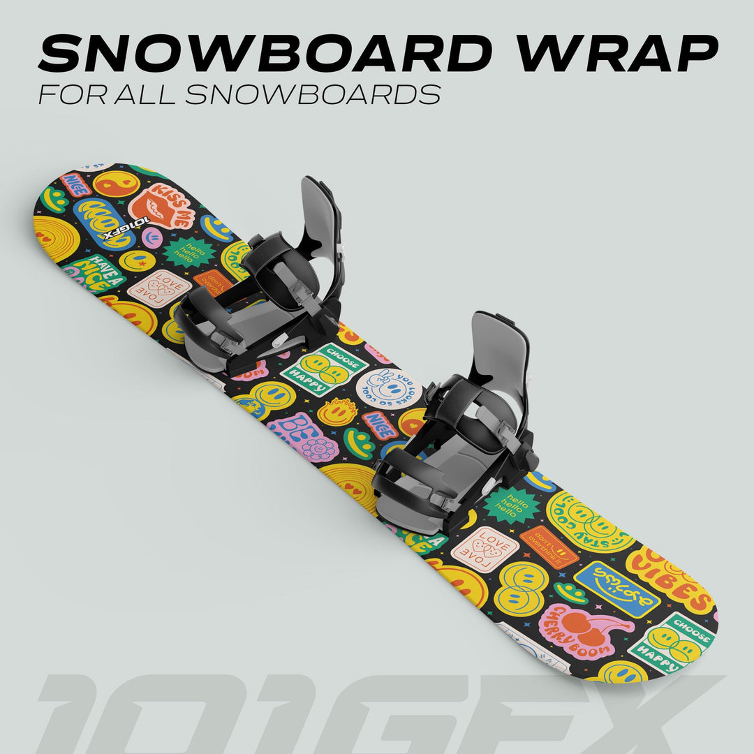 Snowboard with black bindings, featuring GOOD VIBES sticker skin covered in colorful emoji icons and slogans, designed for style and board protection.