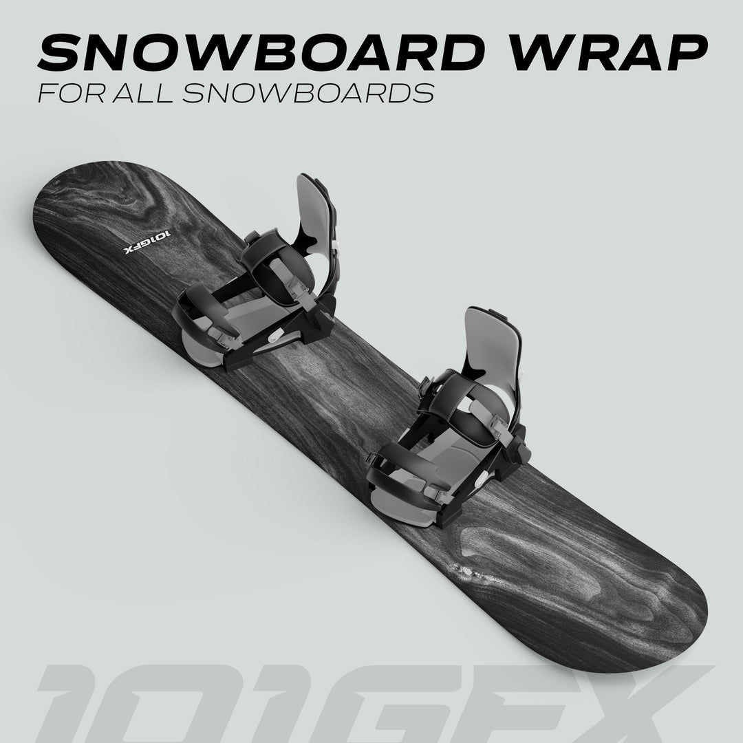 Snowboard Wrap WOOD PLANK GREY with black bindings, showcasing a top-down wood-grain vinyl finish for snowboard customization and protection. Text reads: “SNOWBOARD WRAP FOR ALL SNOWBOARDS.”