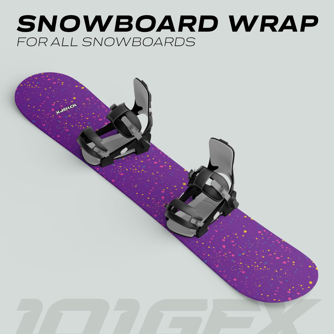 Snowboard Wrap SPLATS PURPLE: A snowboard with a vibrant purple wrap featuring pink, yellow, and blue dots, showcasing bold style and easy application for all boards.