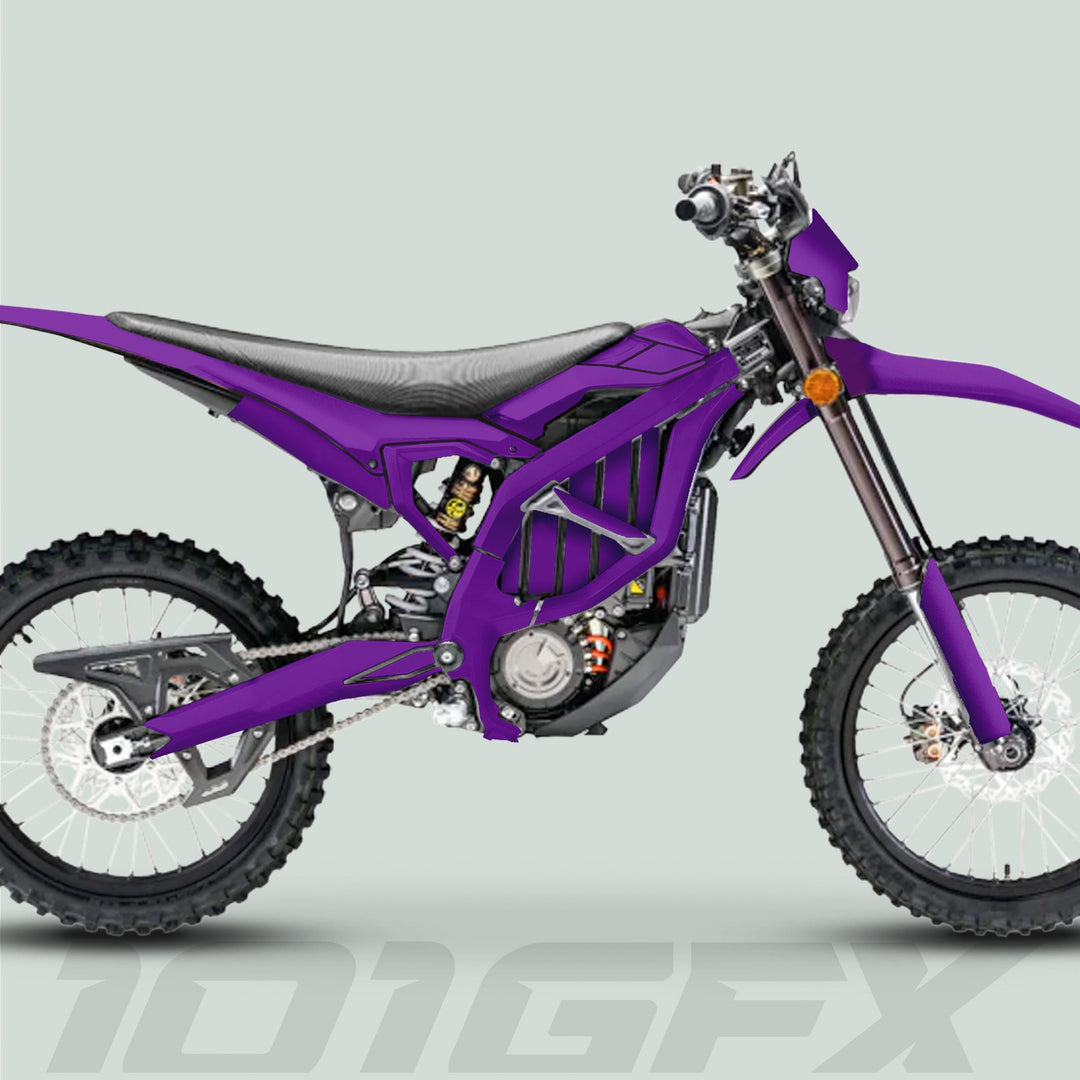 Surron Ultra Bee Graphics Kit SOLID COLOR PURPLE on electric dirt bike, showcasing purple livery, knobby tires, and durable vinyl for enhanced style and protection.
