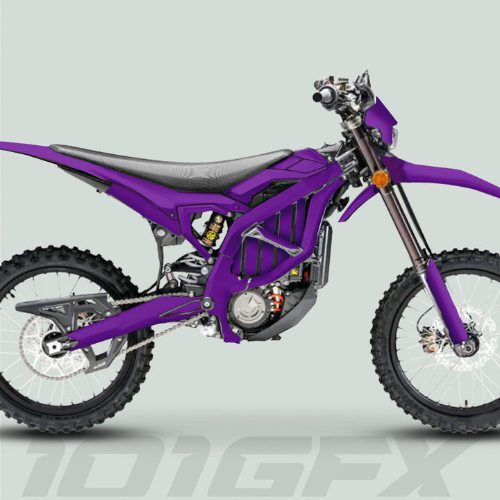 Surron Ultra Bee Graphics Kit SOLID COLOR PURPLE on electric dirt bike, showcasing purple livery, knobby tires, and durable vinyl for enhanced style and protection.
