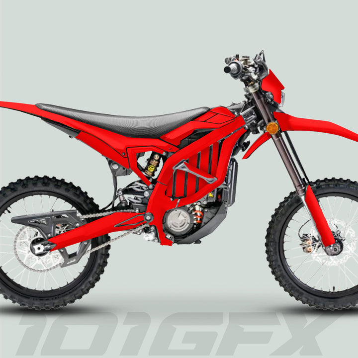 Surron Ultra Bee Graphics Kit SOLID COLOR RED on a red off-road motorcycle, featuring knobby tires, textured seat, exposed frame, showcasing durable, eye-catching decals.
