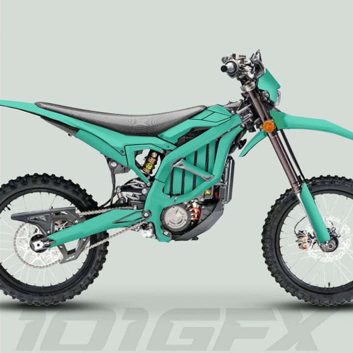 Surron Ultra Bee Graphics Kit SOLID COLOR MINT on a dirt bike, showcasing vibrant turquoise decals, knobbly tires, and detailed suspension components in a side-on render.