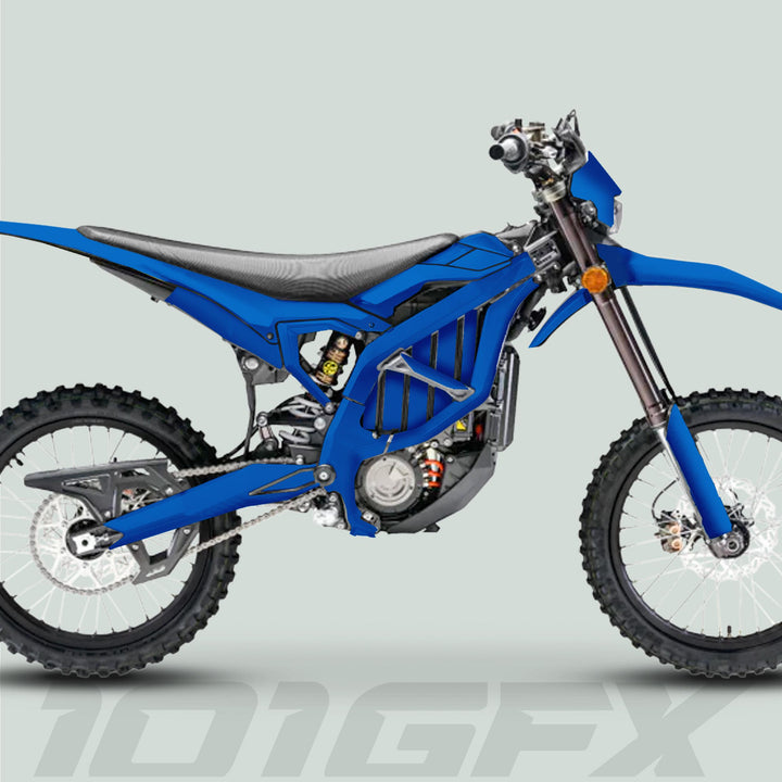Surron Ultra Bee Graphics Kit SOLID COLOR BLUE on an electric dirt bike, showcasing a blue tubular frame, knobby tires, and sleek decals for a personalized look.