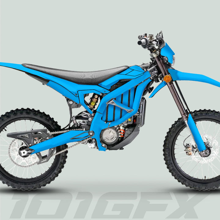 Side-profile of a dirt bike showcasing the Surron Ultra Bee Graphics Kit SOLID COLOR CYAN, highlighting its knobby tires, frame, and durable, stylish decals.