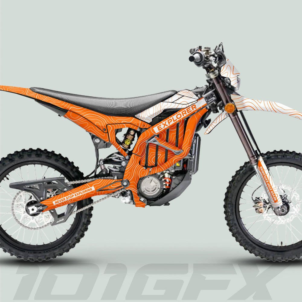 Surron Ultra Bee Graphics Kit EXPLORER ORANGE WHITE on a dirt bike, featuring bold topographic design and NEVER STOP EXPLORING accents for standout style and protection.