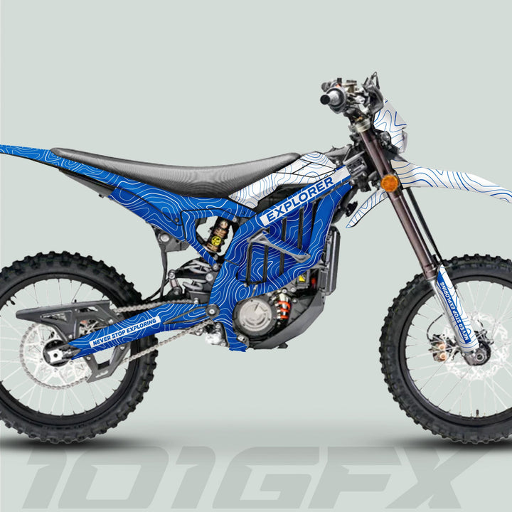 Surron Ultra Bee Graphics Kit EXPLORER BLUE WHITE on an electric dirt bike, showcasing topographic-contour design, EXPLORER branding, and durable, precise-fit decals for trail-ready style.