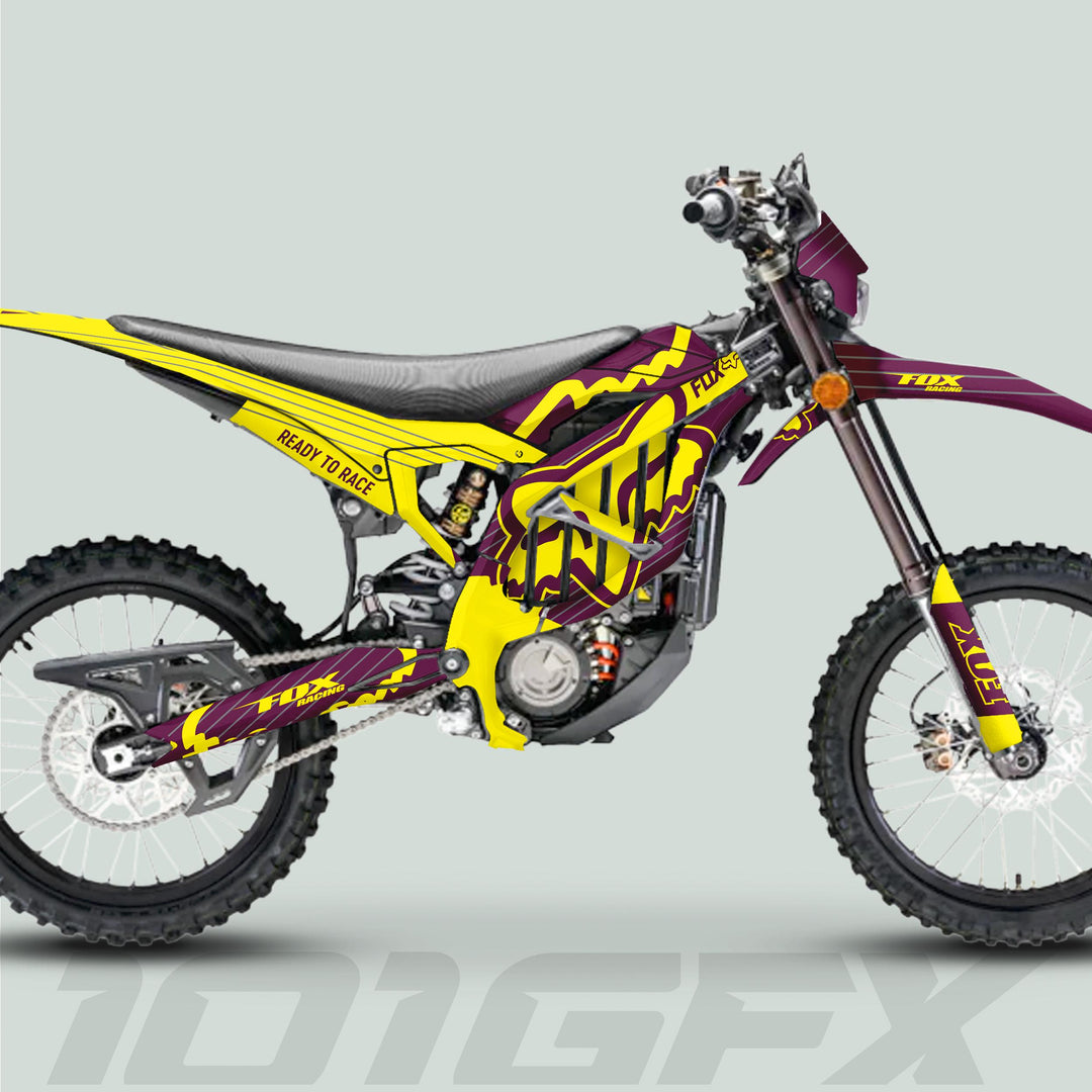 Side-view render of Surron Ultra Bee Graphics Kit FOX STRIPES Purple Yellow on a dirt bike, showcasing bold logos and durable, vibrant decals.