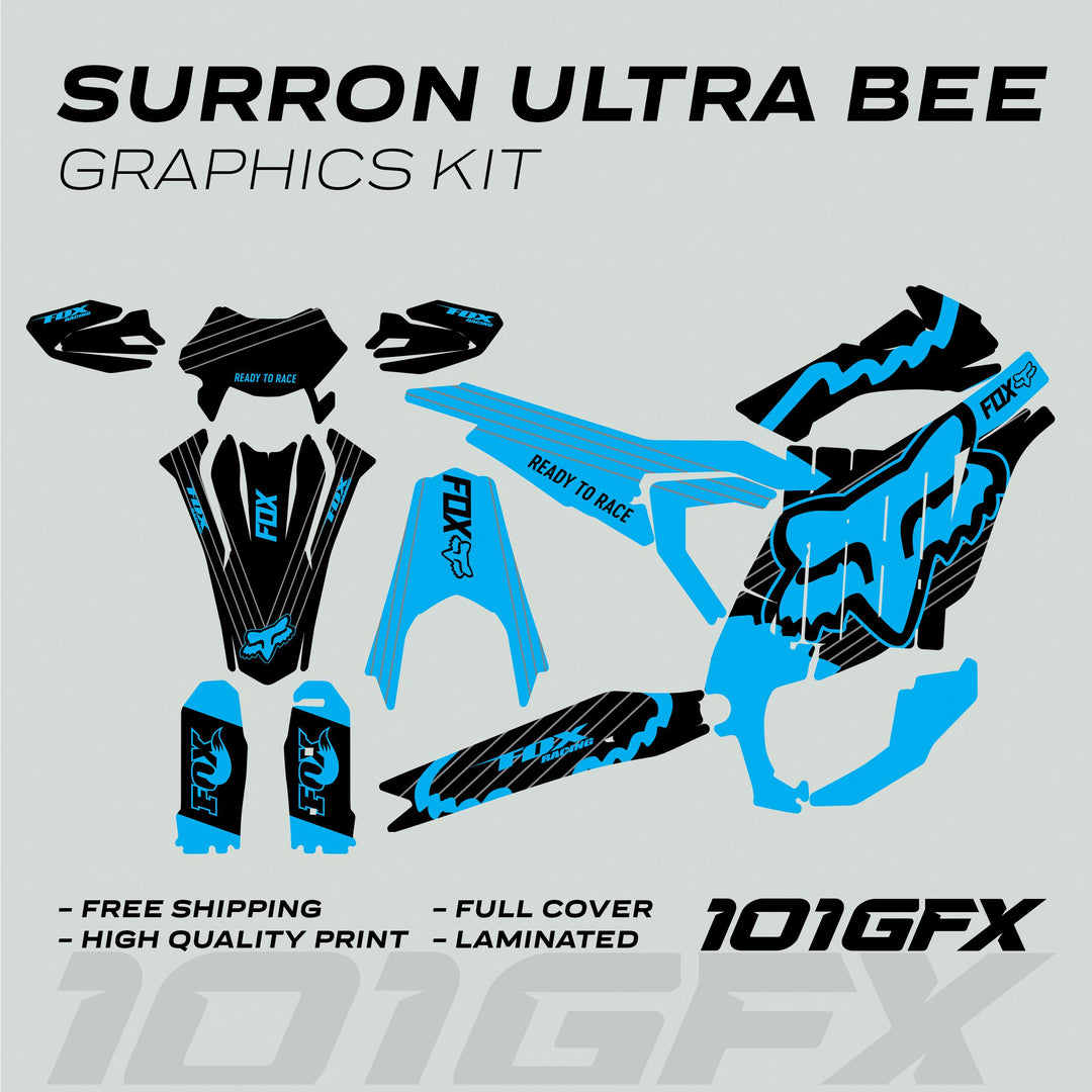 Surron Ultra Bee Graphics Kit FOX STRIPES Black Cyan with black-blue Fox Racing decals, featuring fender panels, fork guards, and shrouds, showcasing “Ready to Race” slogan.