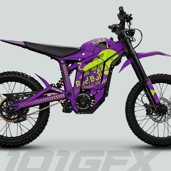Side-profile of Talaria Sting MX5 PRO Graphics Kit with RBULL MONO decals, showcasing purple and lime-green livery, electric motor, off-road tires, and suspension.