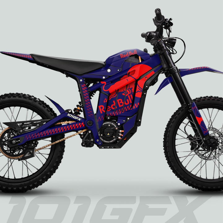 Side-view of a dirt bike featuring the Talaria Sting MX5 PRO Graphics Kit RBULL MONO with Red Bull branding, showcasing knobby tires and electric motor design.