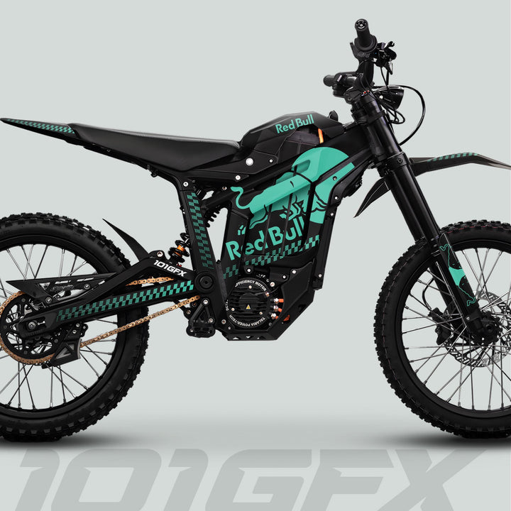 Talaria Sting MX5 PRO Graphics Kit RBULL MONO Black Mint Decals on electric dirt bike, featuring knobby tires, gold drive chain, and visible battery.