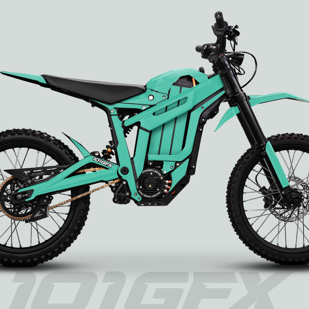 Side-view of a modern electric dirt bike with Talaria Sting MX5 PRO Graphics Kit SOLID COLOR Mint Decals, showcasing knobby tires and minimalist motocross bodywork.