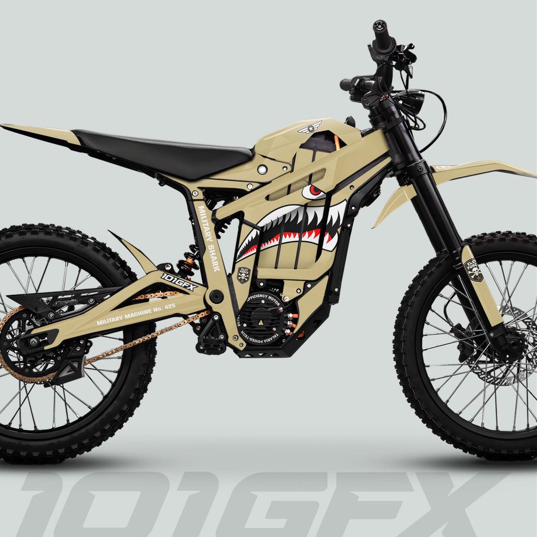 Side-view of Talaria Sting MX5 PRO Graphics Kit MILITARY SHARK Sand Decals on an off-road e-bike featuring shark-mouth graphic, knobby tires, and high-mounted fenders.
