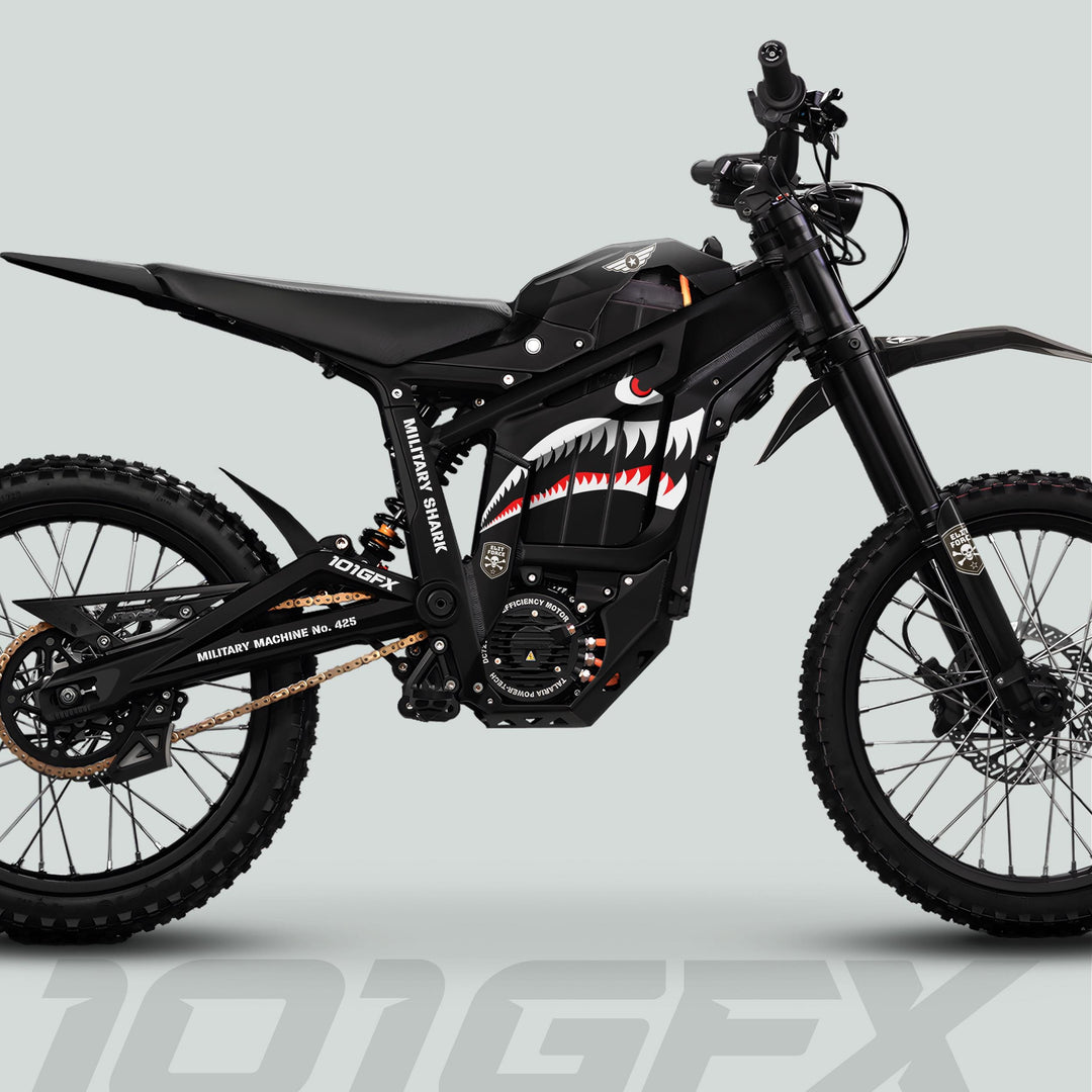 Side-profile of Talaria Sting MX5 PRO with MILITARY SHARK black decals, showcasing knobby tires, tactical design, and distinctive shark-mouth paint on battery cover.