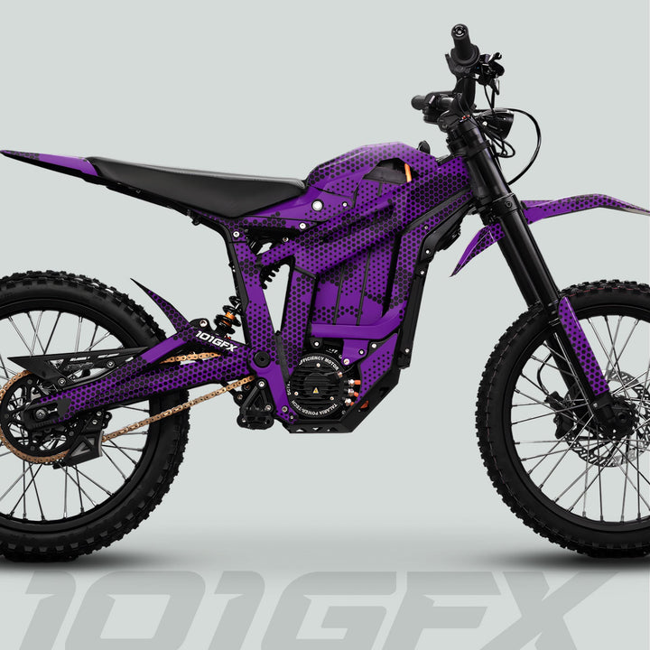 Electric motocross bike with Talaria Sting MX5 PRO Graphics Kit HEXOCAM PURPLE Decals, featuring knobby tires, full suspension, and a honeycomb graphic wrap.