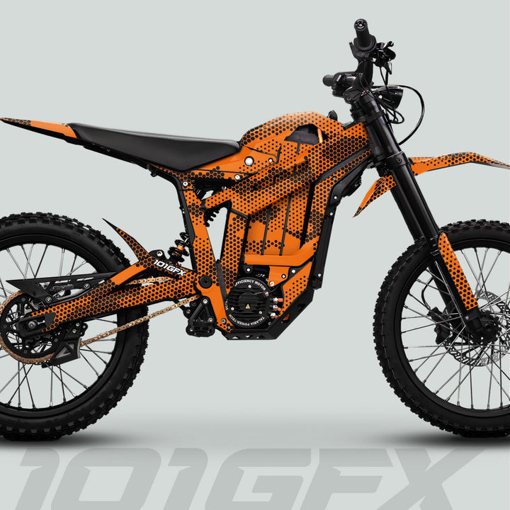 Side-profile of Talaria Sting MX5 PRO with HEXOCAM ORANGE Decals, showcasing knobby tires, inverted forks, and motocross-style seat, highlighting its stylish, durable graphics kit.