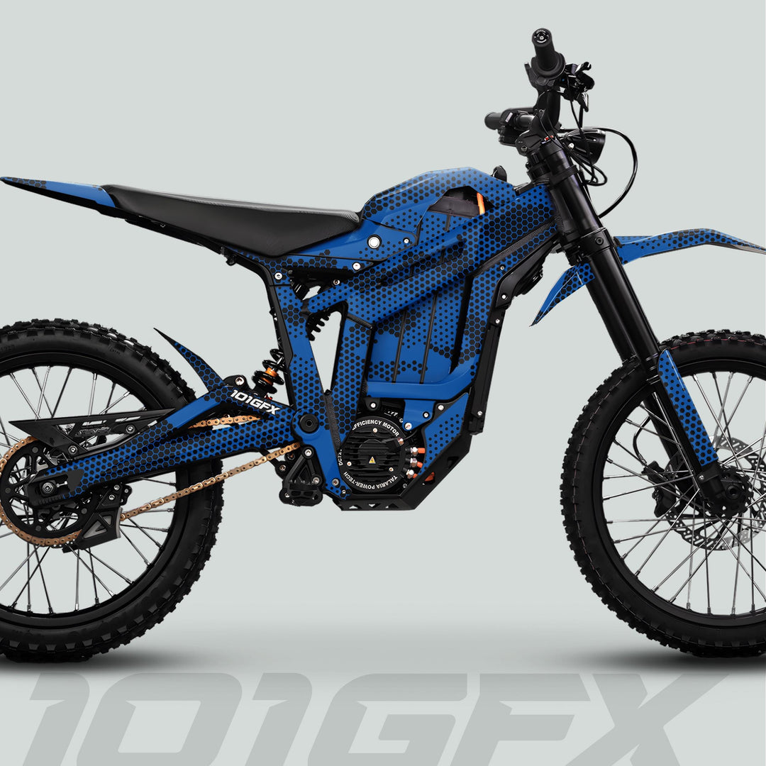Talaria Sting MX5 PRO Graphics Kit HEXOCAM BLUE Decals on a modern electric off-road motorcycle, featuring knobby tires, disc brakes, and robust suspension.