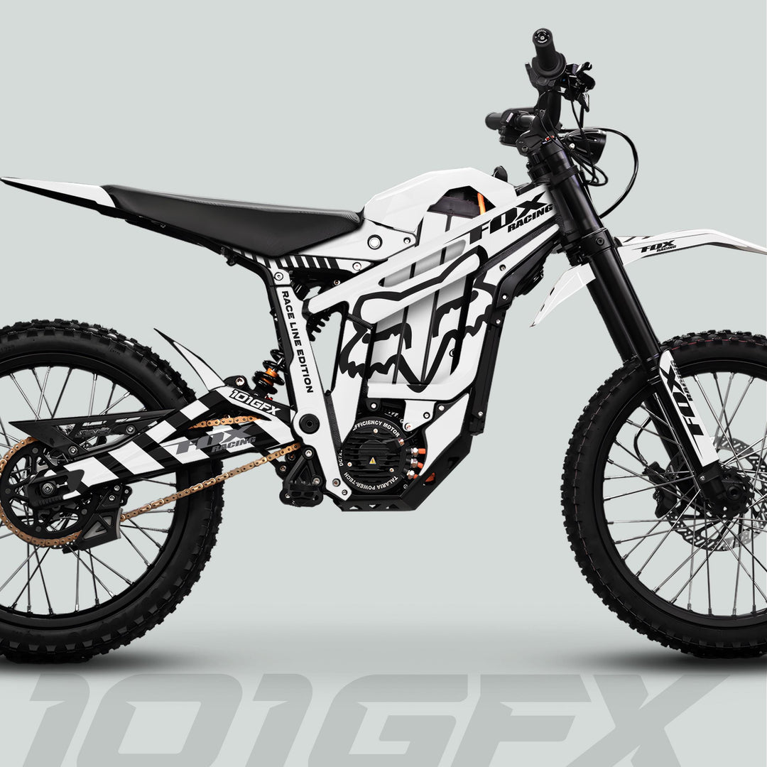 Talaria Sting MX5 PRO Graphics Kit features FOX RACELINE white-black decals on an electric dirt bike with off-road-ready design and components.
