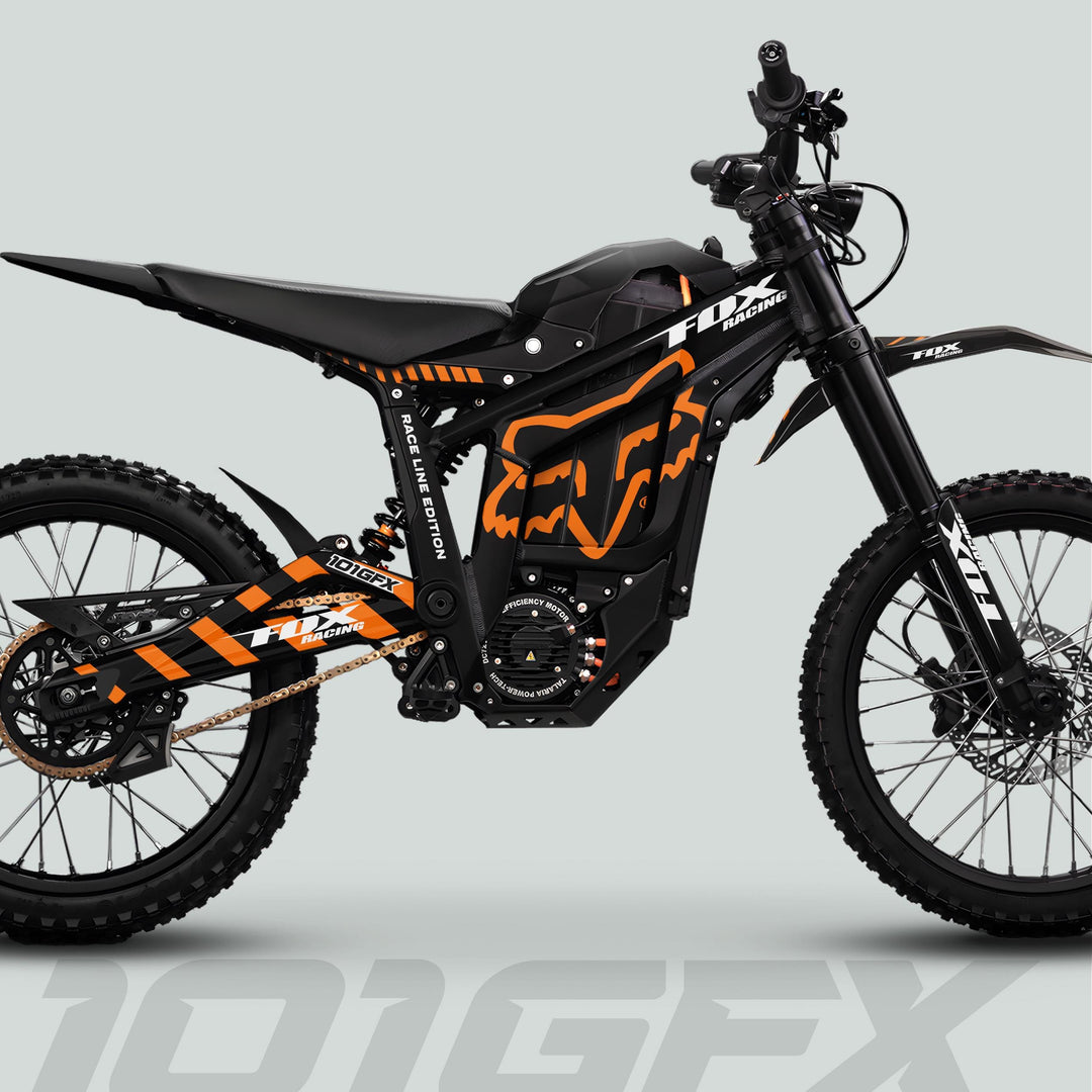 Talaria Sting MX5 PRO Graphics Kit with FOX RACELINE decals on an off-road electric dirt bike, featuring knobby tires, central motor, and long-travel suspension.