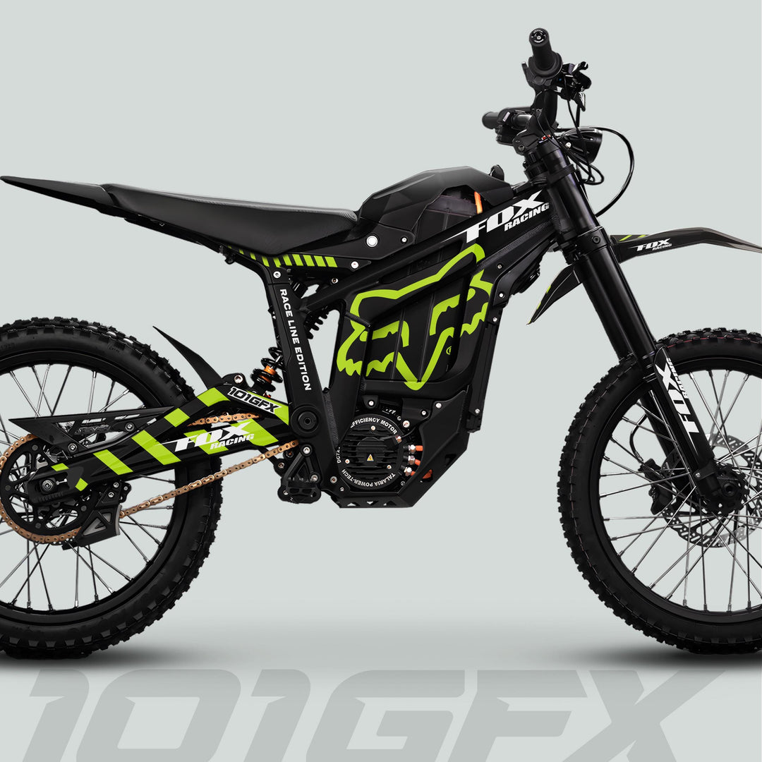 Side view of Talaria Sting MX5 PRO with FOX RACELINE black and green decals, showcasing Fox Racing graphics, knobby tires, and electric motor.
