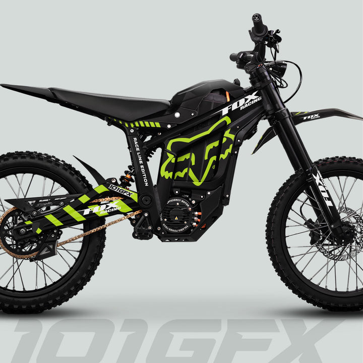 Side view of Talaria Sting MX5 PRO with FOX RACELINE black and green decals, showcasing Fox Racing graphics, knobby tires, and electric motor.