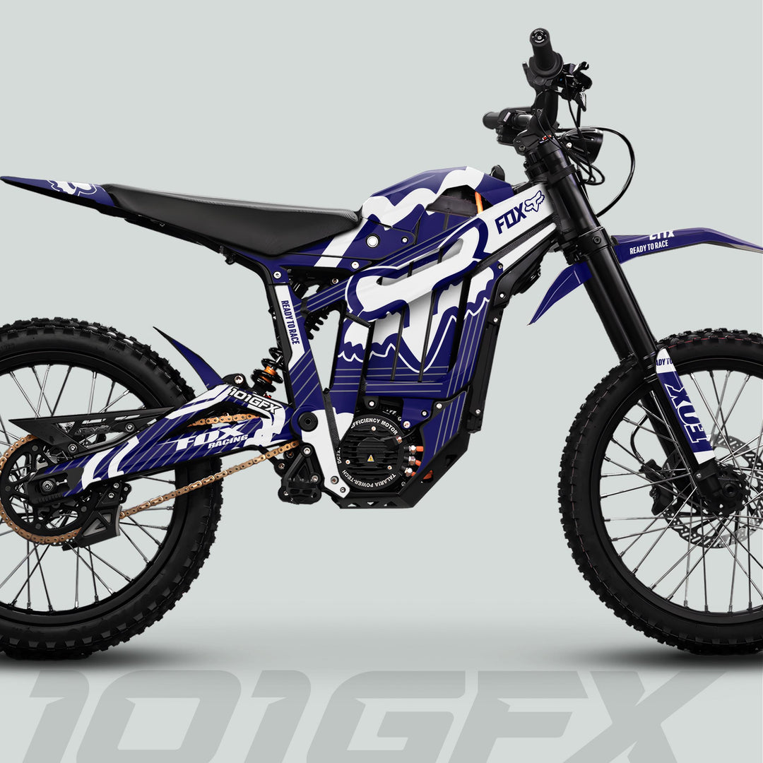 Talaria Sting MX5 PRO Graphics Kit FOX STRIPES on an electric dirt bike with Fox Racing livery, knobby tires, and advanced suspension for off-road performance.